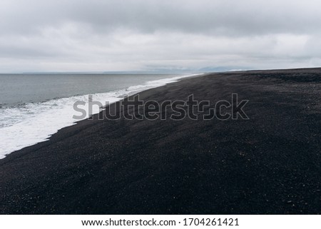 Atlantic coast with black beach. The Black sand beach of Reynisfjara.