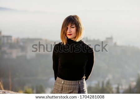 woman posing in a viewpoint