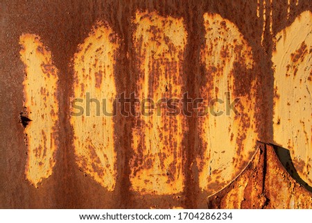 Ochre rusty metal wall with round frames