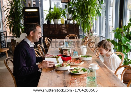Family of two enjoying time together in a cafe