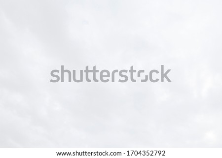 Abstract nature texture of beautiful puffy fluffy white clouds on sky background with bright sunlight & sun rays in tropical summer or spring daylight sunshine day for wallpaper, purity concept, space