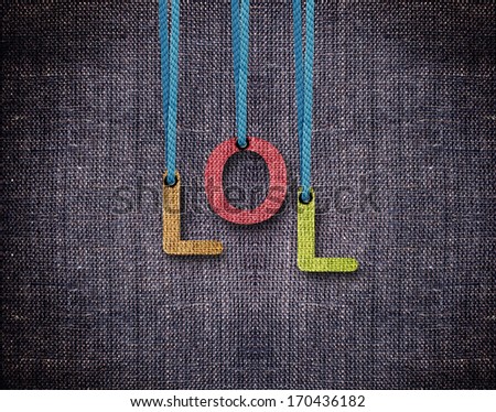 Lol Letters hanging strings with blue sackcloth background.
