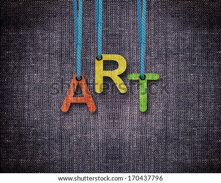 Art letters hanging strings with blue sackcloth background.