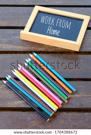 Small Mini Blackboard with Colour pencils and caption.