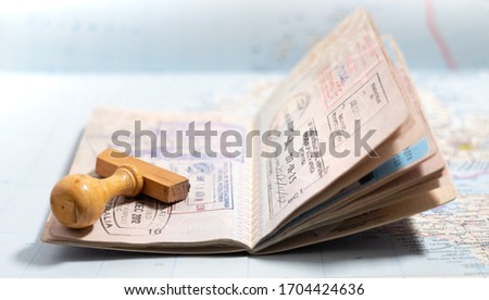 Italian passport pages with a lot of visa stamps. Royalty-Free Stock Photo #1704424636