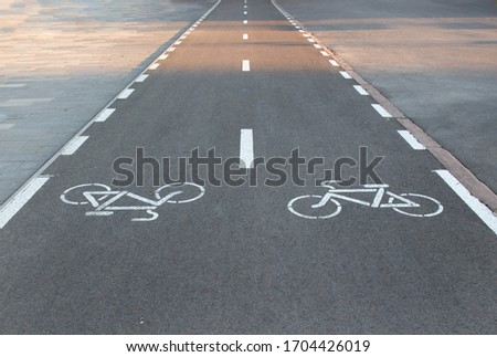 Marking a bike path on the sidewalk