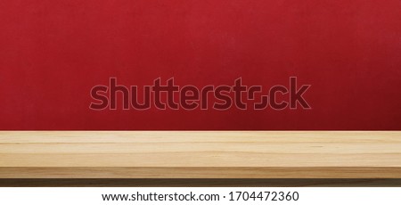 Wood table and red wall background, Wooden shelf, counter for food and kitchen product display montage backdrop, Tabletop, desk surface banner, mockup, template presentation background, wallpaper Royalty-Free Stock Photo #1704472360