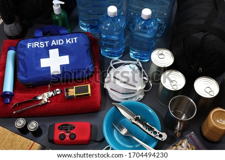 Disaster management includes preparing a disaster kit that can be contained in a go bag.These items should include a first aid kit,food,water,flashlight,radio,sleeping bag.Items that will help you. Royalty-Free Stock Photo #1704494230