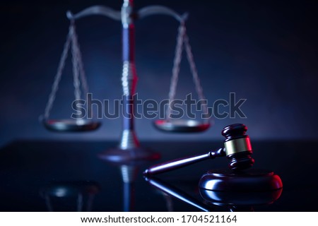 Judge's gavel, scales, statue of justice. Red light. Law and order social justice  concept.