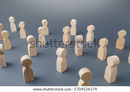 Many figures of people stand at a distance. People Society Concept. Behavior and social science relationships. Manipulation and management. Marketing, segmentation, consumer market research. Royalty-Free Stock Photo #1704526174