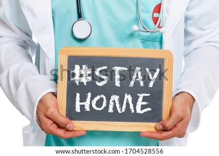 Stay home hashtag stayhome Corona virus coronavirus doctor ill illness health slate board Royalty-Free Stock Photo #1704528556