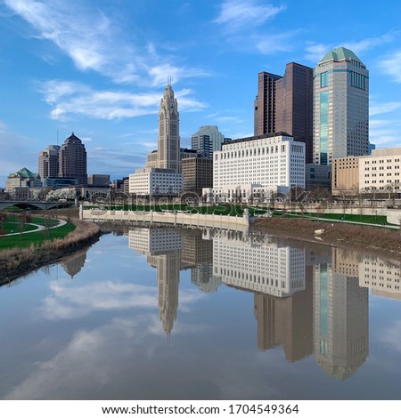 Columbus, Ohio / USA - Skyline reflected in the Scioto River. Columbus is the capital of Ohio. At John W. Galbreath bicentennial park in the afternoon.