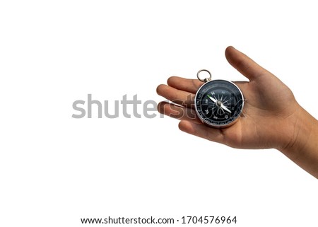 Compass in hand isolated on white background.