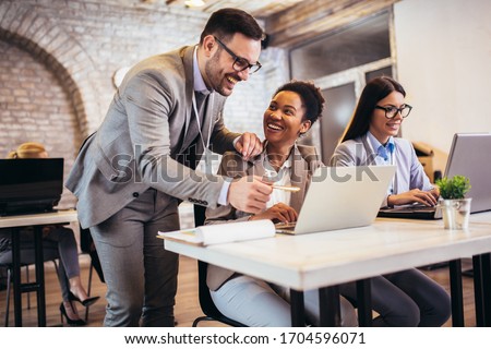 Group of business people working in office and discussing new ideas Royalty-Free Stock Photo #1704596071