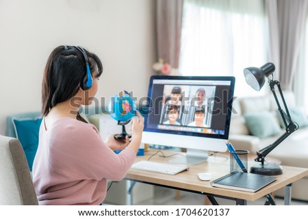Asian woman teacher teaching geography via video conference e-learning and cheerful elementary school student looking at globe, Homeschooling and distance learning ,online ,education and internet.
 Royalty-Free Stock Photo #1704620137