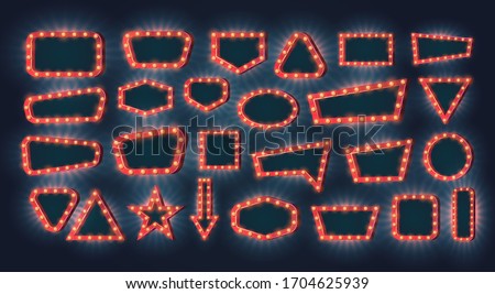 Retro light frames. Vector set of neon light bulbs with glow effect on a dark background with empty space inside. Free copy space for your text or design. Concept for casino or other games. Royalty-Free Stock Photo #1704625939