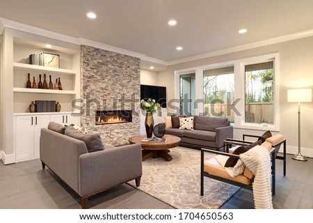 Luxury large natural modern and rustic living room interior with brown sofas. 