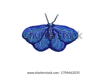 Spring fashion accessory brooch, isolated on white, can be used to print on clothes. Blue moth or butterfly with antennae, shiny beads, fashion item Royalty-Free Stock Photo #1704662035