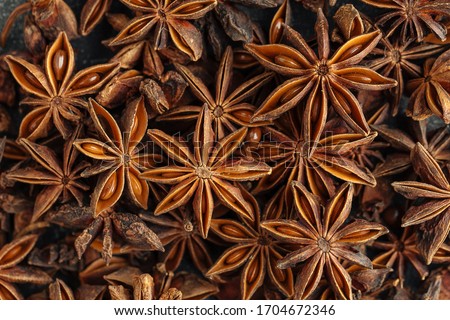 Top view closeup macro on fragrant spice anise, horizontal format Royalty-Free Stock Photo #1704672346