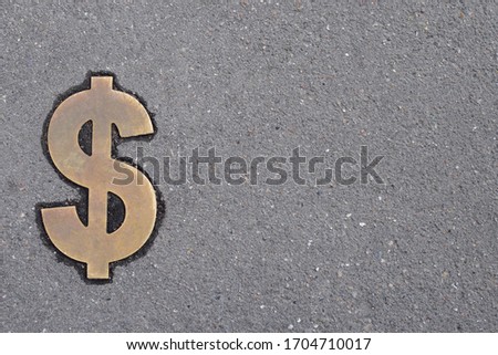 Bronze dollar currency symbol symbol on asphalt background
