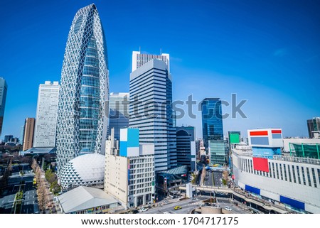 Skyscraper in front of Shinjuku Station, Tokyo Royalty-Free Stock Photo #1704717175