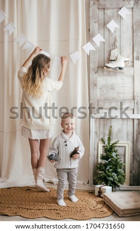 Stock Photo - Baby boy and mother in the style of Rustic
