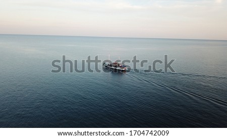 A boat floating on the sea in Cyprus from a drone