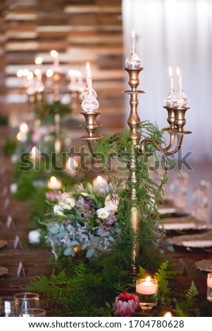 wedding decor with flowers and candles and centre pieces