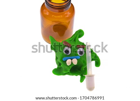 corona virus toy and medicine bottle
