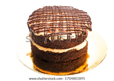 A picture of salted caramel cake on isolated white background.