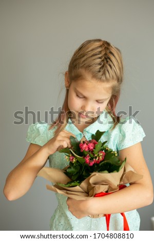 Mother's day. Mom. Mom card with fresh flowers. Happy Mothers Day. Beautiful young gerl smiling. Happy holiday concept.