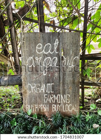Wooden banner poster slogan of organic restaurant.