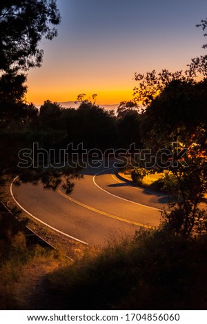 twilight sky above the curvy road in Berkley, California, USA Royalty-Free Stock Photo #1704856060