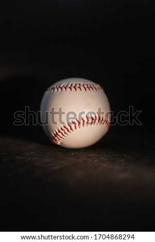 
baseball ball on a black background
