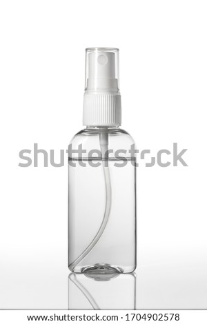 Instant antiseptic hand sanitizer mist spray, antibacterial alcohol liquid. One transparent plastic bottle with atomizer pump isolated on white background, studio shot. Mini travel pocket small size. Royalty-Free Stock Photo #1704902578