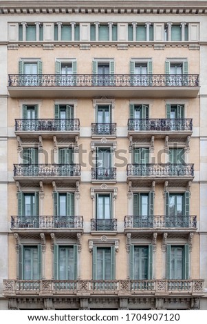 Typical building facade that you can find throughout the city of Barcelona Royalty-Free Stock Photo #1704907120