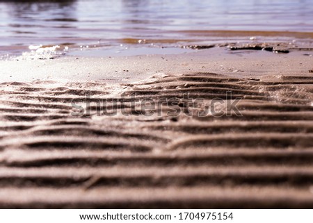 wet sand at beach coastline texture background.wave form
