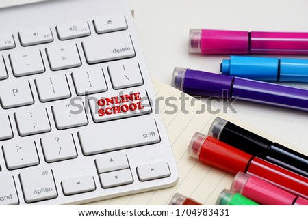Colored marker pen, book, keyboard and mouse. concepts of home schooling and online schooling.
