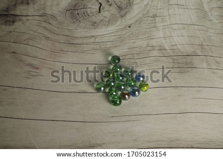 A marble ball shaped on a wooden table