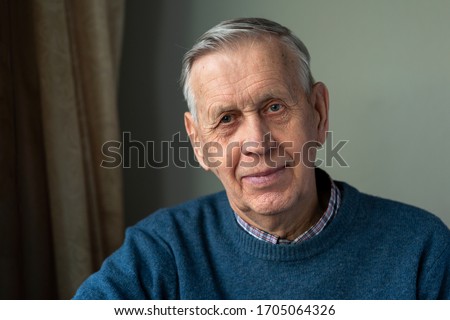 Portrait of a handsome, happy old man, 80 years old, smiling. Royalty-Free Stock Photo #1705064326