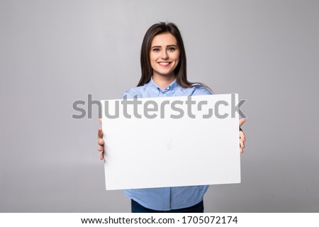 Woman holding blank card. Isolated on white background smiling female portrait.
