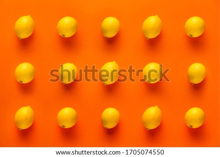 lemon vitamin pattern on an orange background