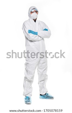 Man in chemical protective suit making stop gesture on white background. Virus. Royalty-Free Stock Photo #1705078159