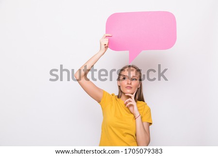 Young beautiful girl holding a pink bubble for text, isolated on white background