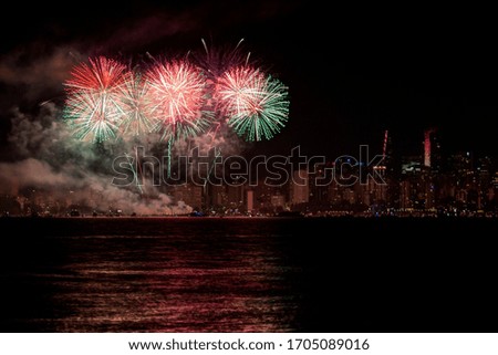 fireworks with cityscape in the background