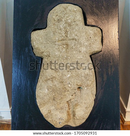 Close-up view of ancient stone cross. Religion concept.