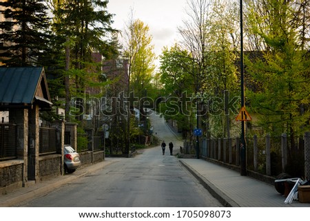 Zakopane Poland walk in the city sunset green nature. chilled mood with nearly empty street. Near tatry mountains small city with polish culture.