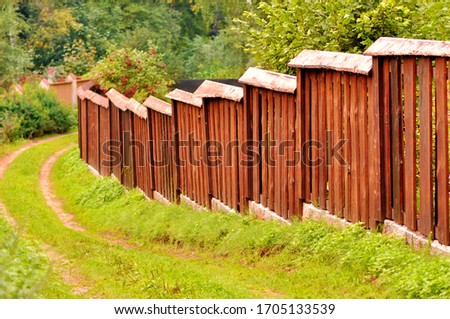 steps descending wooden fence in colorful autumn background