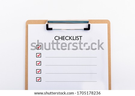 "CHECKLIST" concept. Note pad and white paper on white background, copy space Royalty-Free Stock Photo #1705178236