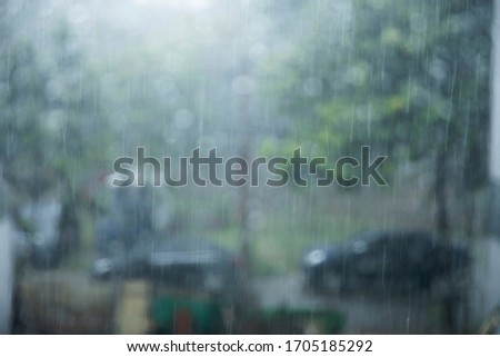 Raindrops looking through the glass. This footage fits a sad mood, a lonely person looking out the window with raindrops outside. It gives off a cold, lonely feeling